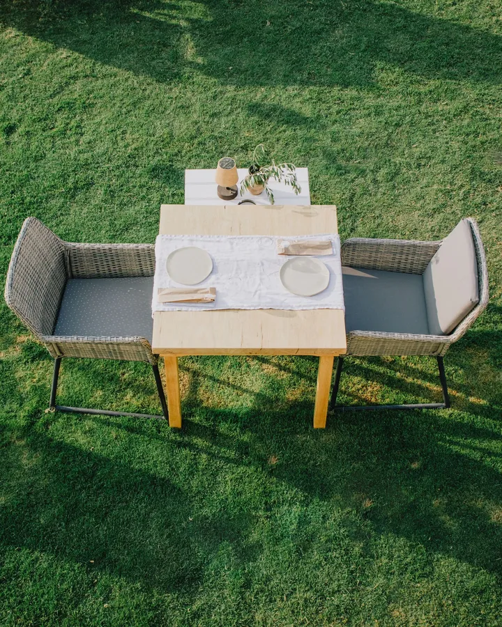 Table set on a lawn for an outdoor meal